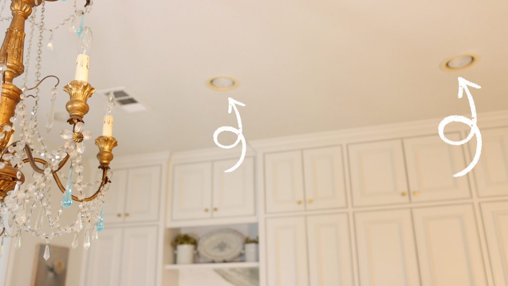 Arrows pointing to the recessed lighting installed into Amitha’s kitchen ceiling.