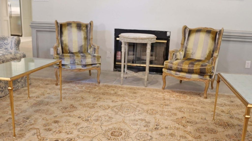 A pair of reupholstered antique chairs add character to Amitha Verma’s family room by introducing functional and unique pieces of farmhouse furniture.