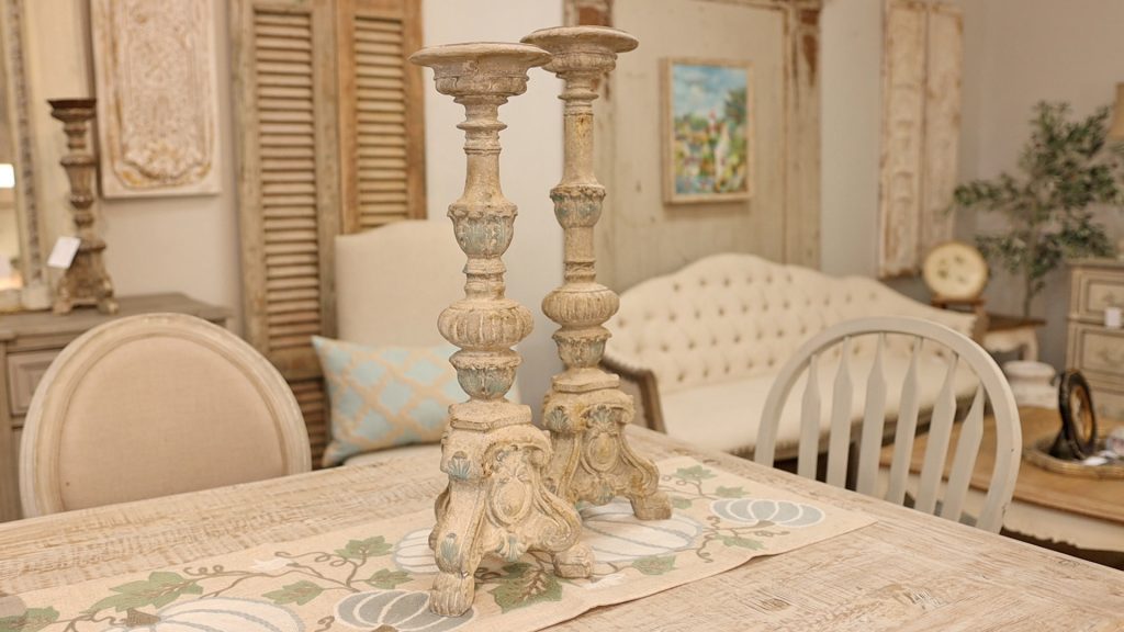 Amitha Verma adds tall chippy candlesticks to her simple farmhouse fall table design to create varying heights.
