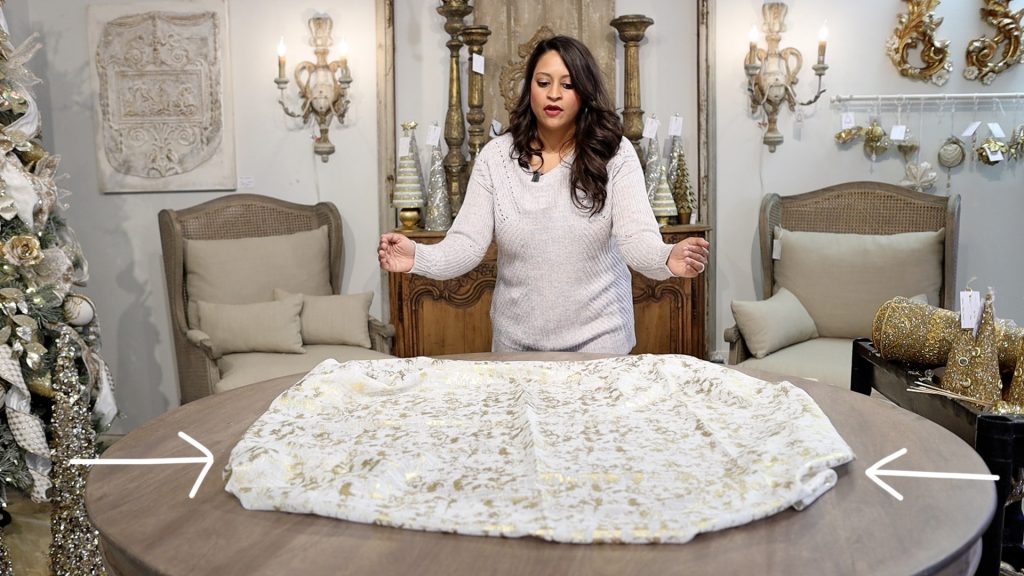 Since Amitha Verma is not using her round farmhouse table to dine on, she leaves her tablecloth to be a little bit wider, meaning less space to the edge.