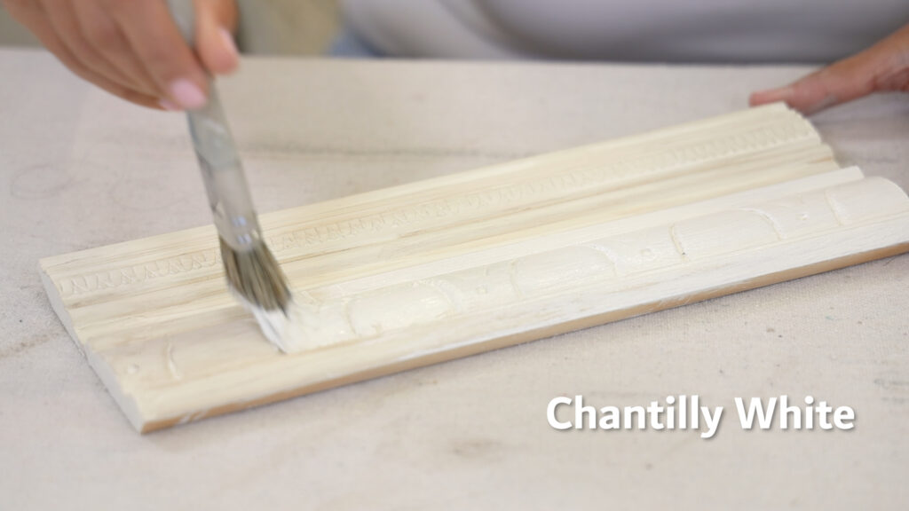 To begin her chest of drawers makeover, Amitha Verma started with two coats of Chantilly White all over.